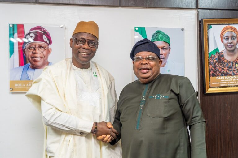 DG, NCSP, Joseph Tegbe with the Minister of Health and Social Welfare, Dr. Isiaq Salako